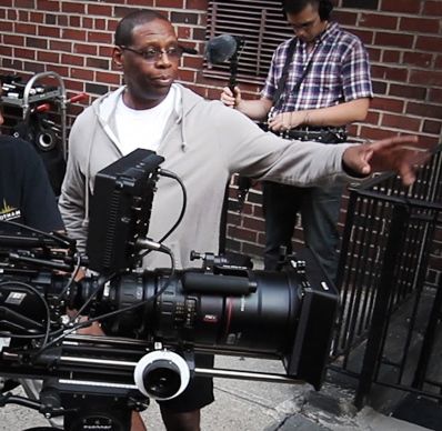 Jacob C. Williams directing beside a film camera